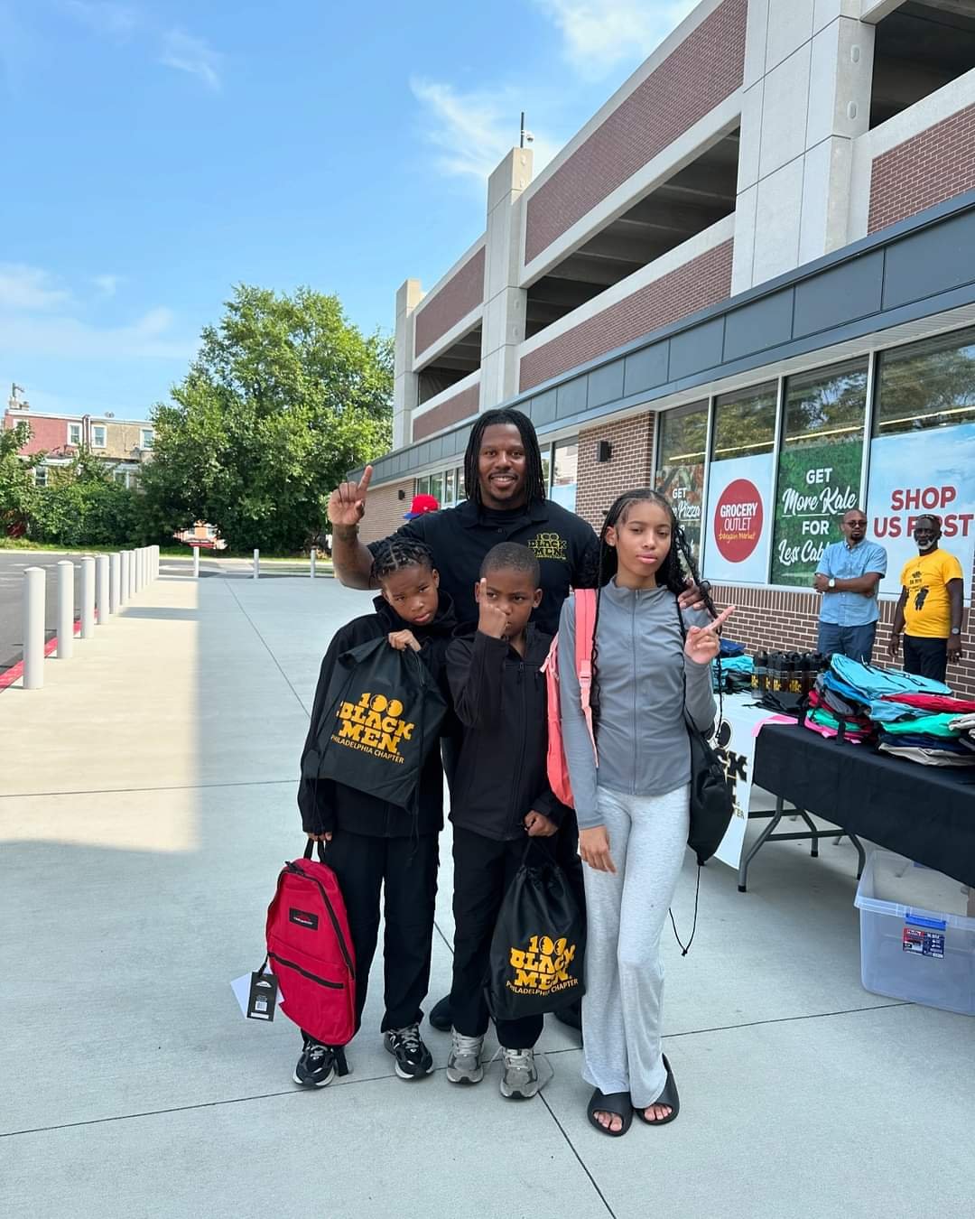 100 Black Men of Philadelphia gives away book bags and school supplies ahead of school year 